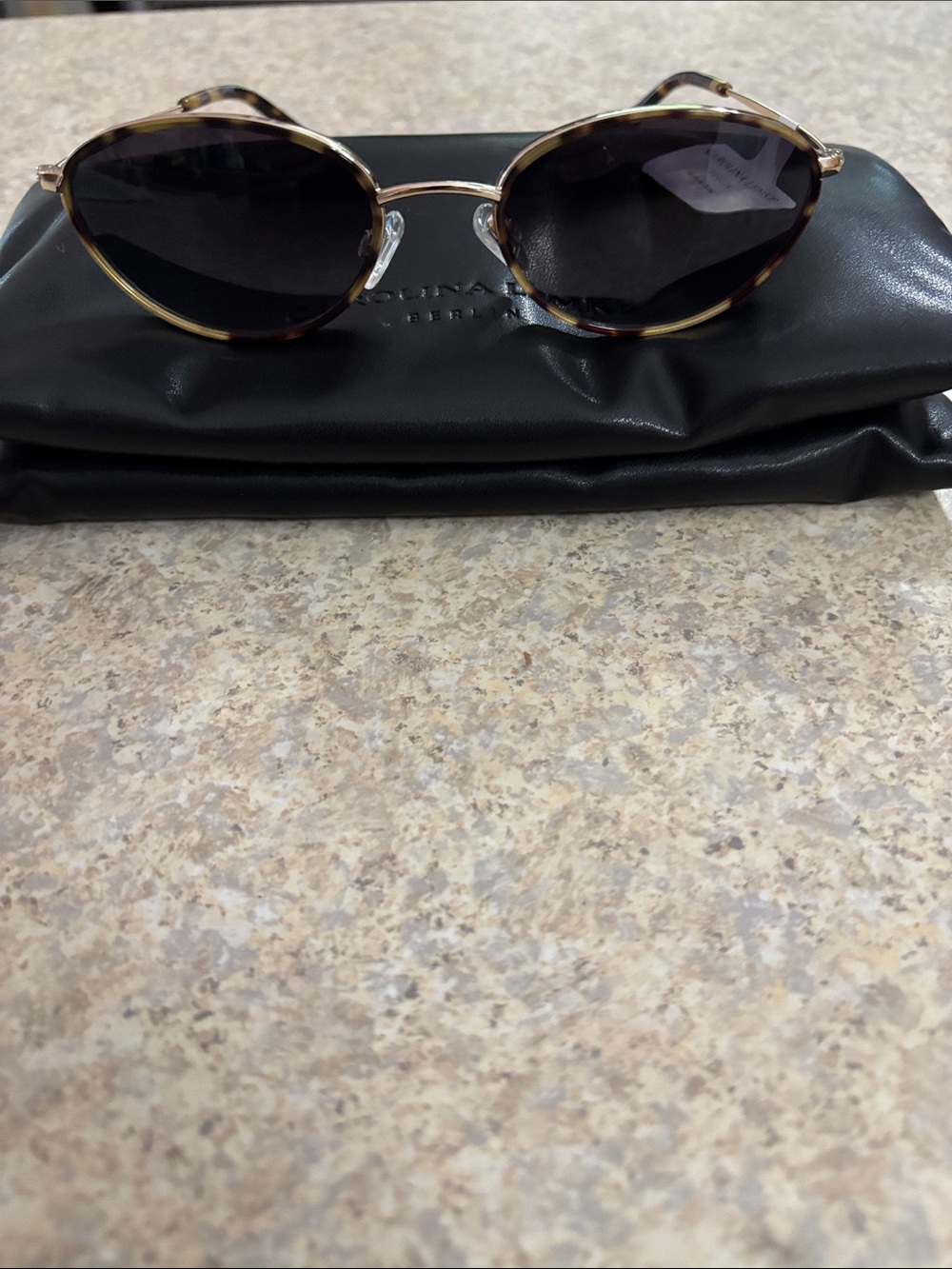 Carolina Lemke oval Frame tigereye Sunglasses with brown Lenses.